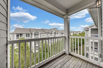 The view from the deck of a home with a balcony
